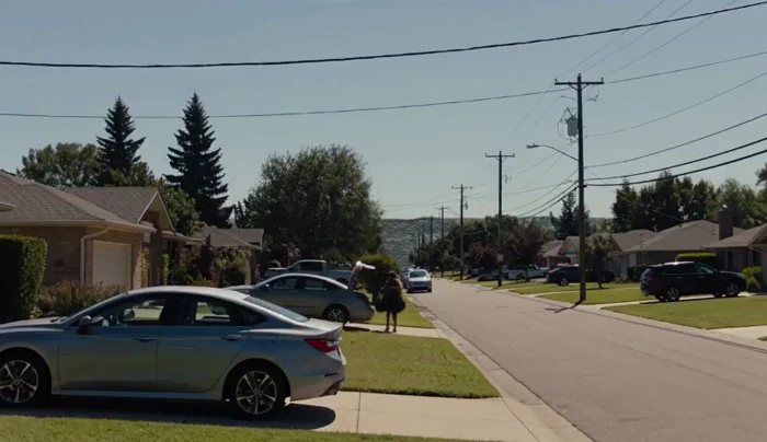 The Sky Descends Like a Giant Wall over a Suburban Street